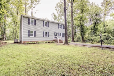 Colonial house featuring crawl space and a front y