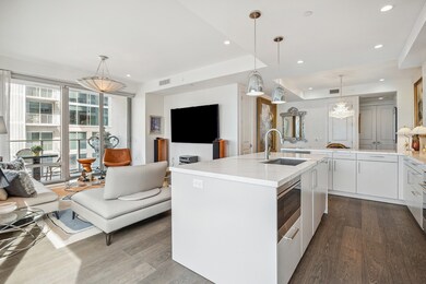 Alternate view of the kitchen and living area.