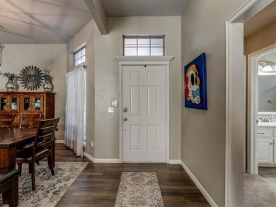 Foyer with dark hardwood / wood-style floors and b