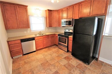 Stainless steel appliances, dual sink, tiled floor