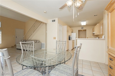 Dining area featuring light tile patterned floorin