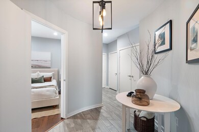 Corridor featuring light wood finished floors and 