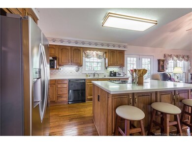 This open kitchen has Custom Schmidt cabinetry, Co