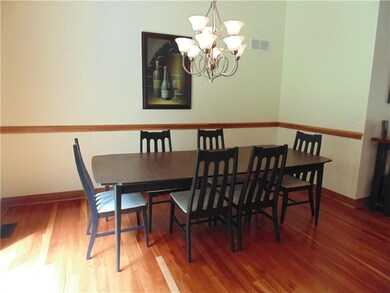 The dining area is spacious and has plenty of natu