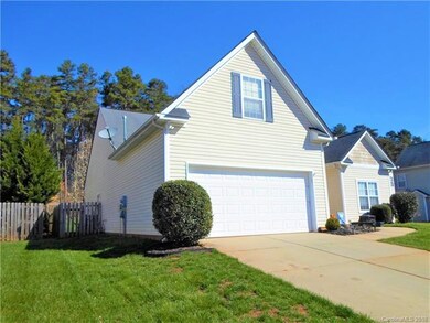 House sits back from street with long driveway for