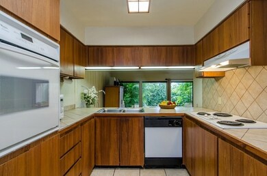 Plenty of cupboard space in this well equipped kitchen.
