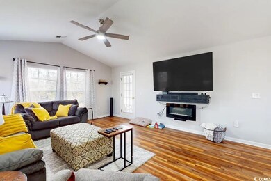 Living room with ceiling fan, light hardwood / woo