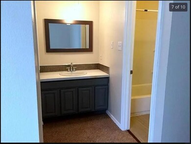 Bathroom with vanity and baseboards