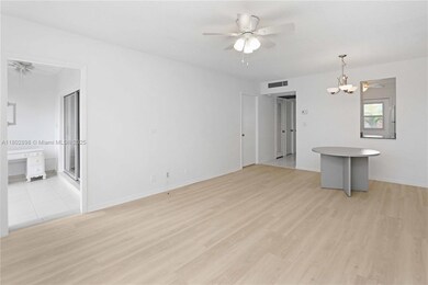 The sunroom can be accessed through the living room