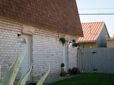 View of side of property with brick siding