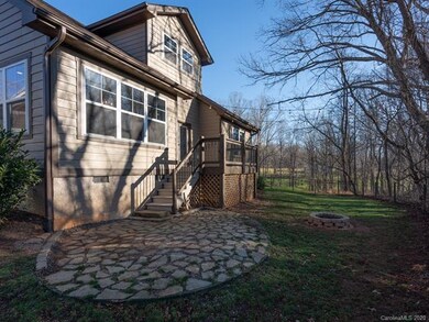Back porch with stone patio and firepit