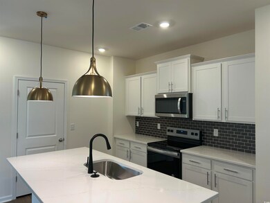 Kitchen featuring appliances with stainless steel 