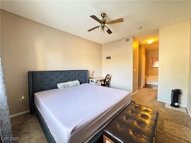 Primary bedroom located on one side of the unit fo