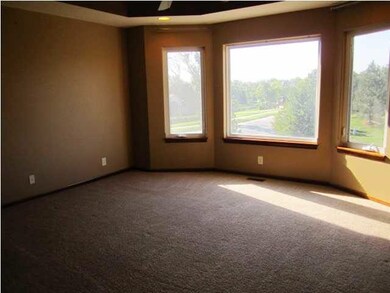 Master bedroom is spacious and offers a coffered c
