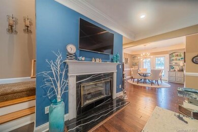 Wide plank hardwoods cover the main floor living s