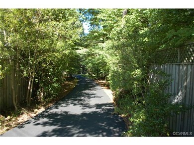 A private paved driveway leads to the house off Ro