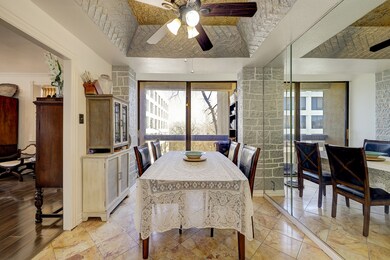 Off the kitchen is a light oversized breakfast room with an accent mirror and high ceiling which flows into the FORMAL DINING ROOM..