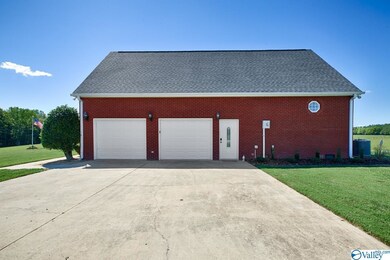 With 2-car attached garage and concrete parking ar
