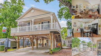 View of front of house with a deck and a storage u