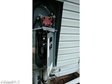 Exterior Back. Outside Breaker box damaged