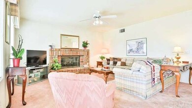 Family Room area with brick fireplace and ceiling 