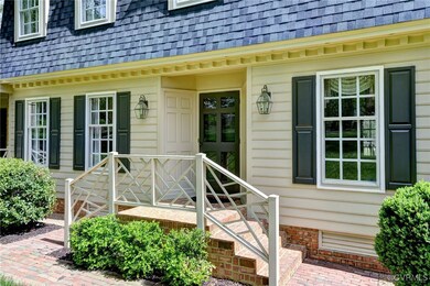 Doorway to property with a shingled roof