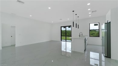 Spare room featuring visible vents, recessed light