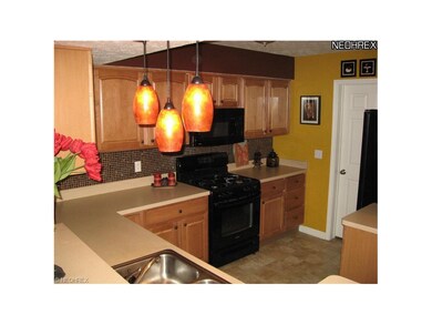 Kitchen also features pull out shelving in all cabinets lazy Susan and breakfast bar eating area.