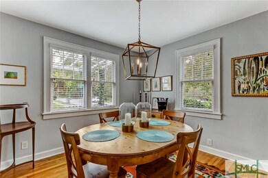 Light, bright dining room with plenty of space to 