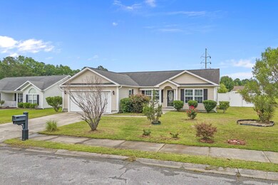 Ranch-style house featuring an attached garage and driveway