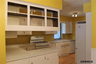So the kitchen is opened up by taking the doors off the cabinet and showing off your pretty dinnerware -- as there is plenty of cabinetry in this kitchen!