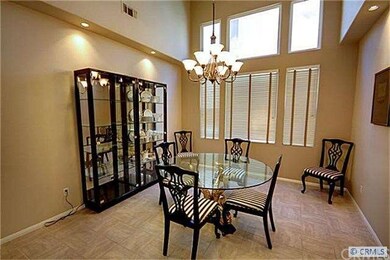 Two story dining room with beautiful lighting