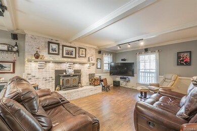 Gorgeous family room with brick fireplace, beamed 