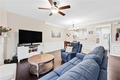 Living area with a decorative wall, a wainscoted w