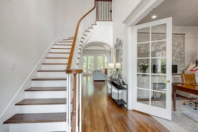 Foyer has 20ft ceiling and pretty arched mouldings