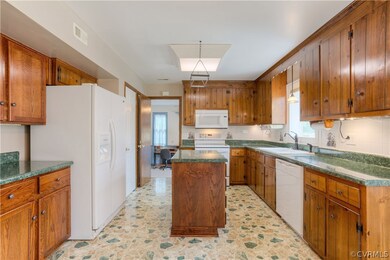 The kitchen connects to the added living space for flexible uses!