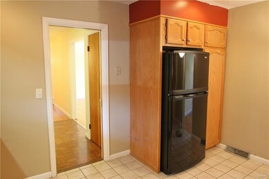 Kitchen connects to the hallway.