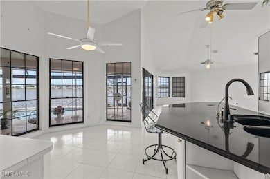 Kitchen featuring light tile patterned flooring, s