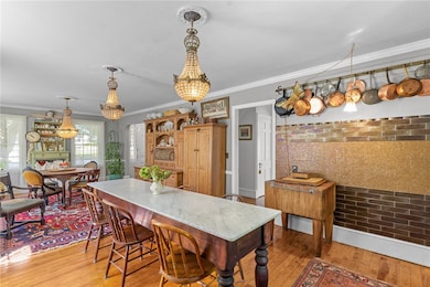 Front to back kitchen and dining with gas burning fireplace and window seat.