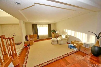 Spacious sunken formal living room with trey ceili