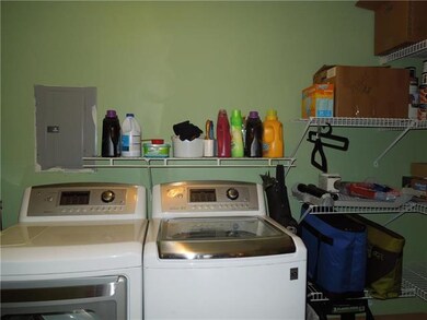 Laundry room and storage off of kitchen.