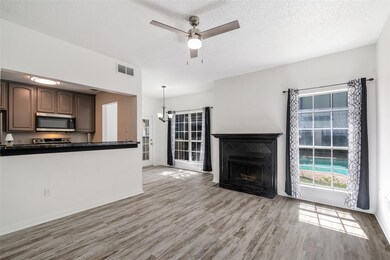 Unfurnished living room with ceiling fan with nota