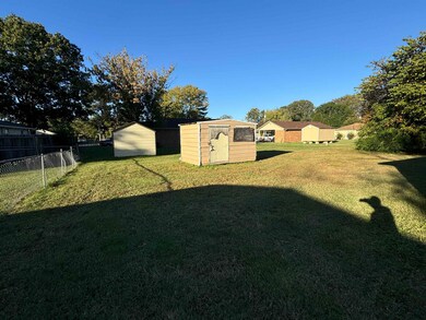 View of yard with a storage unit