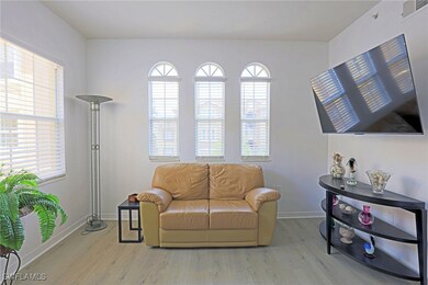 Living area with wood finished floors and baseboar