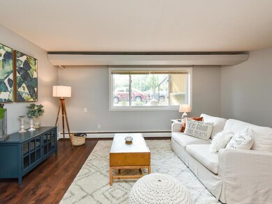 Large living space with new flooring throughout