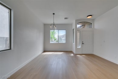 Entryway featuring light wood-style flooring, base