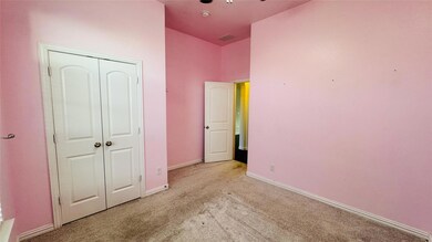 Unfurnished bedroom with a closet, carpet, and baseboards
