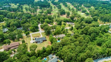 Drone shot of home and Sunset Country Club