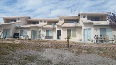 REAR VIEW WITH COVERED  BALCONY IN ALL FIVE