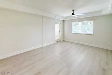 Unfurnished room with light wood-style floors and a ceiling fan